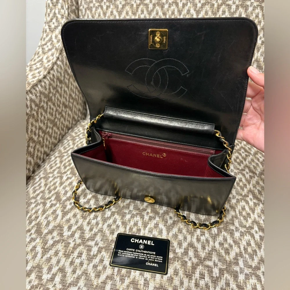 CHANEL Black Quilted Lambskin Flap Bag with Gold Chain